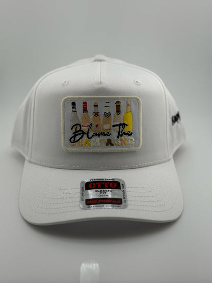 Blame the Champagne Patched Linen Trucker Hat
